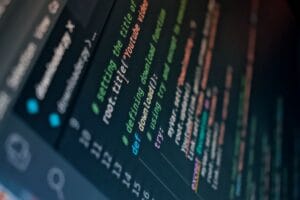 Detailed view of computer code highlighting syntax in colors on a screen.