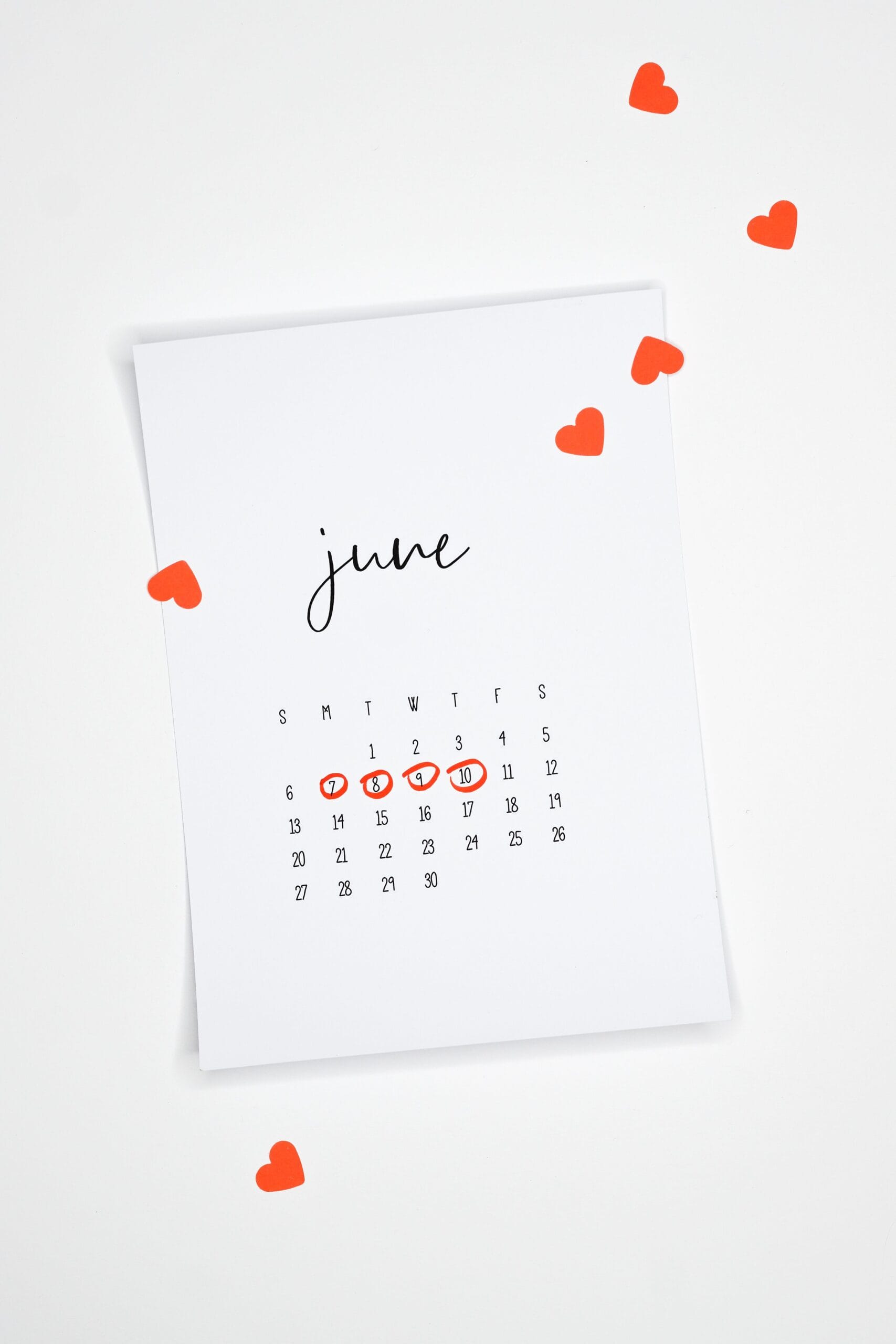A minimalist June calendar page adorned with red hearts for a romantic touch.